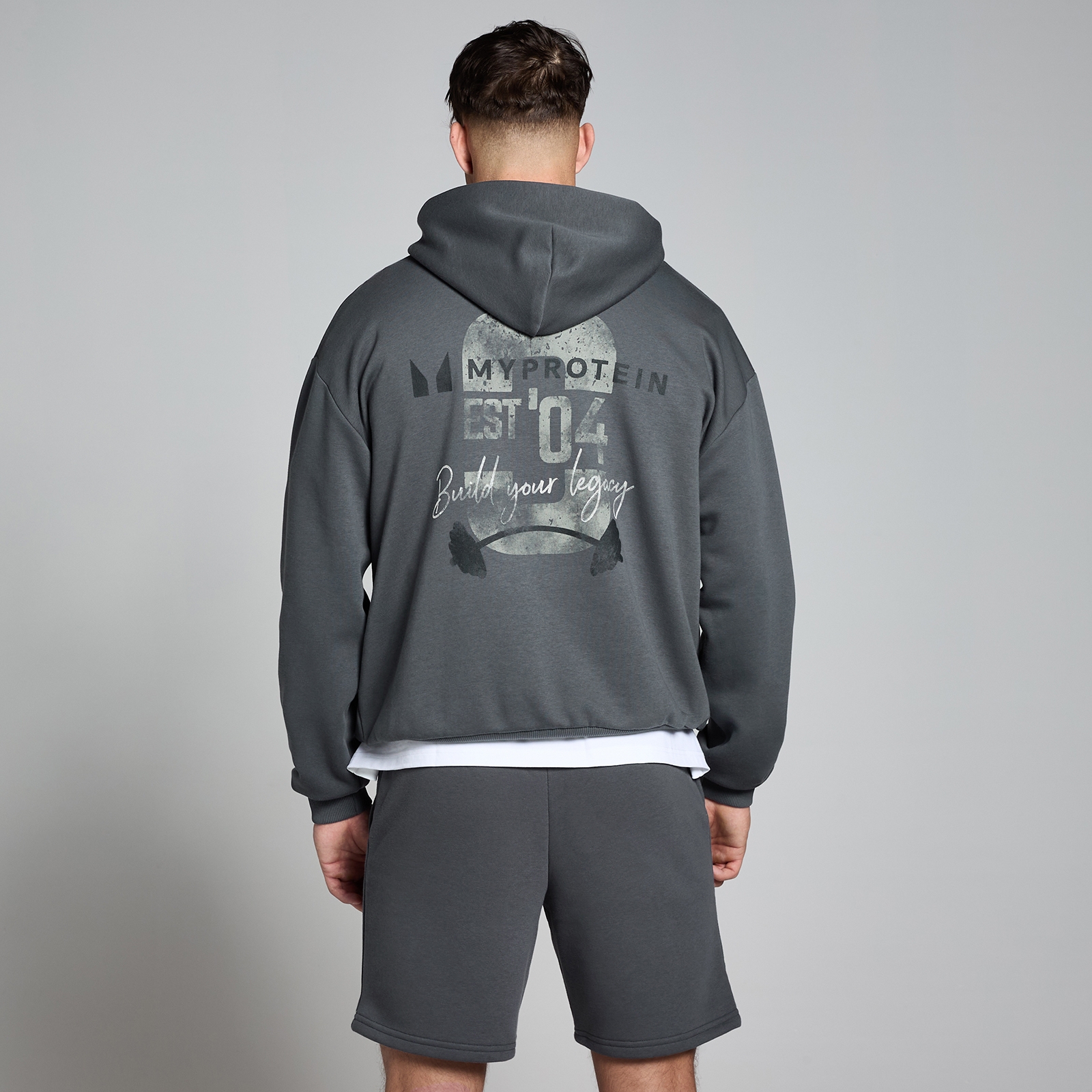 5059883418407 - Origin Kapuzenpullover mit Grafik – Verwaschenes Grau - S-M